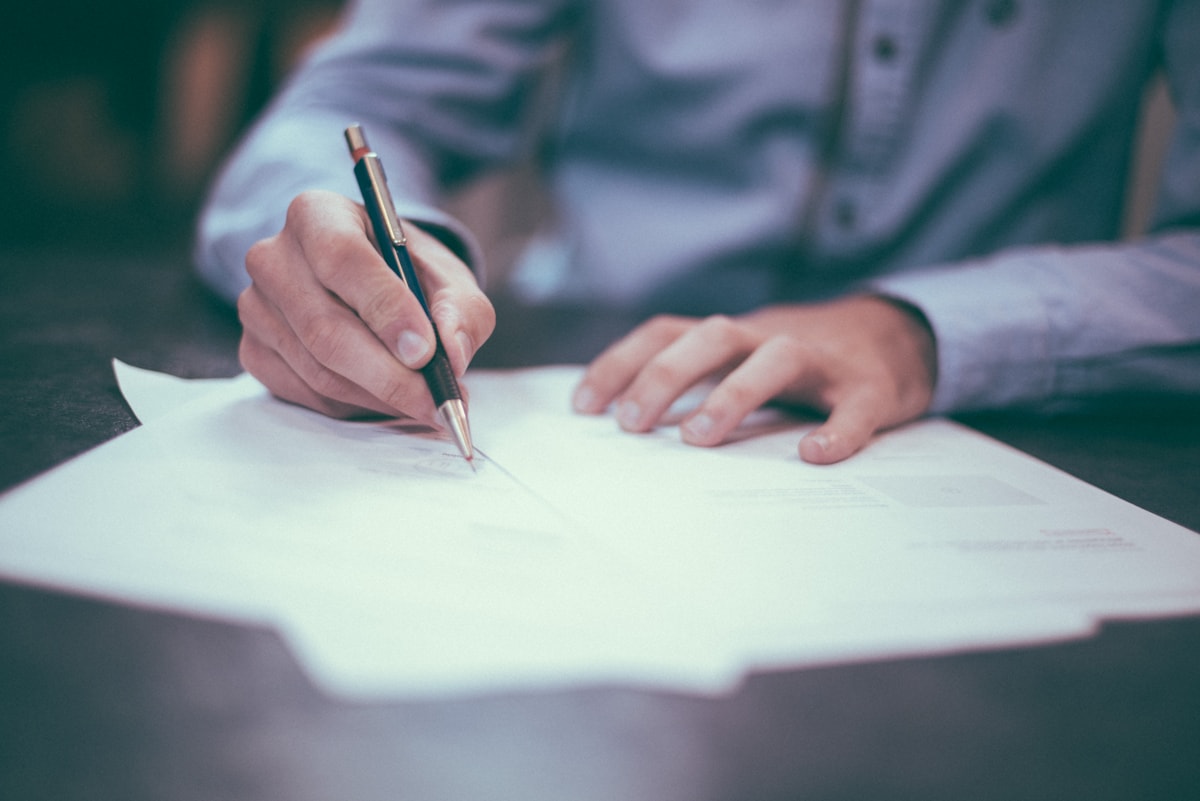 Company registration documents and paperwork on a desk